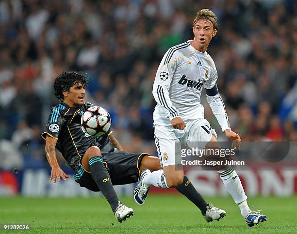 Jose Maria Gutierrez of Real Madrid duels for the ball with Lucho of Marseille during the Champions League group C match between Real Madrid and...