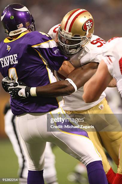 Manny Lawson of the San Francisco 49ers hits Brett Favre of the Minnesota Vikings during the game at Hubert H. Humphrey Metrodome on September 27,...