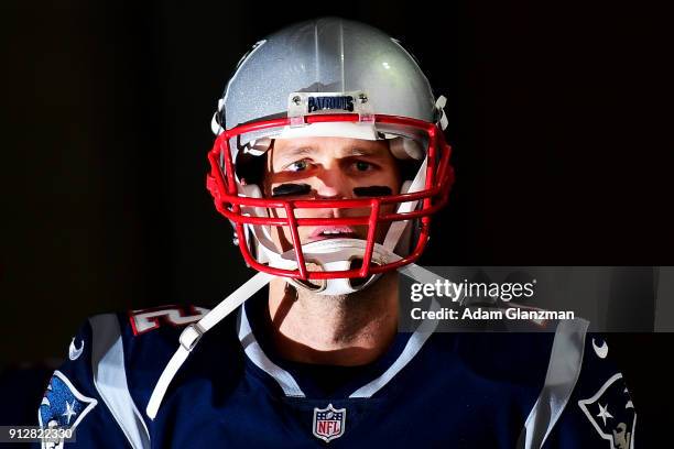 Tom Brady of the New England Patriots walks through a tunnel before the AFC Championship Game against the Jacksonville Jaguars at Gillette Stadium on...
