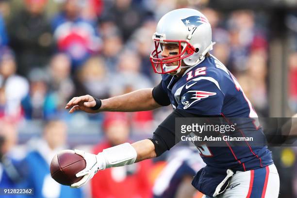 Tom Brady of the New England Patriots hands the ball off during the AFC Championship Game at Gillette Stadium on January 21, 2018 in Foxborough,...