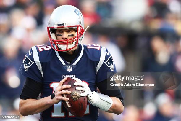 Tom Brady of the New England Patriots looks to pass during the AFC Championship Game at Gillette Stadium on January 21, 2018 in Foxborough,...