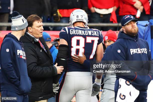 Rob Gronkowski of the New England Patriots walks off the field after an injury in the second quarter during the AFC Championship Game against the...
