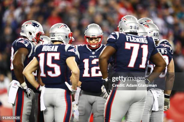 Tom Brady of the New England Patriots talks to his teammates during the AFC Championship Game at Gillette Stadium on January 21, 2018 in Foxborough,...