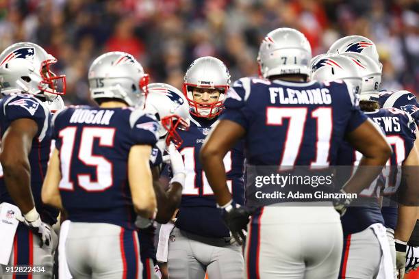 Tom Brady of the New England Patriots talks to his teammates during the AFC Championship Game at Gillette Stadium on January 21, 2018 in Foxborough,...