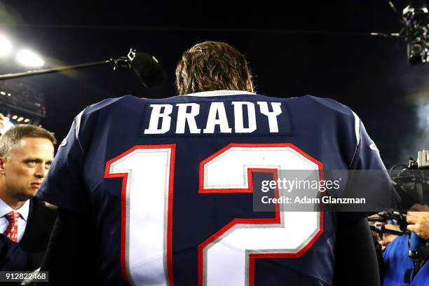 Tom Brady of the New England Patriots celebrates after winning the AFC Championship Game against the Jacksonville Jaguars at Gillette Stadium on...