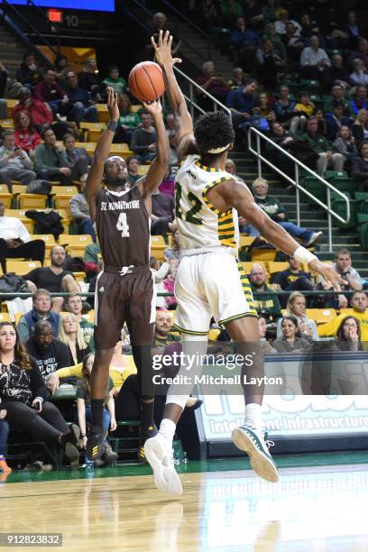 Nelson Kaputo of the St. Bonaventure Bonnies takes a shot over AJ Wilson of the George Mason Patriots during a college basketball game at Eagle Bank...