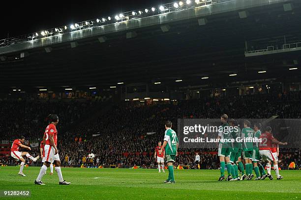 Ryan Giggs of Manchester United scores his team's first goal during the UEFA Champions League Group B match between Manchester United and VfL...