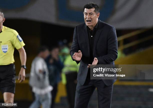 Jorge Almiron, coach of Atletico Nacional gives directions to his players during the final first leg match between Millonarios and Atletico Nacional...