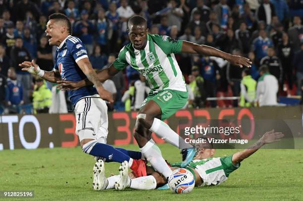 Ayron del Valle of Millonarios fights for the ball with Helibelton Palacios of Atletico Nacional during the second leg match between Millonarios and...