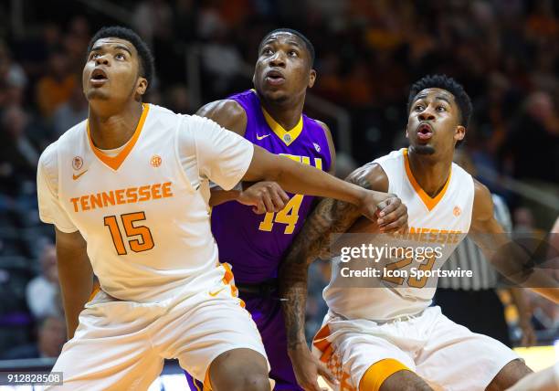 Tennessee Volunteers forward Derrick Walker and guard Jordan Bowden box out LSU Tigers guard Randy Onwuasor during a game between the LSU Tigers and...