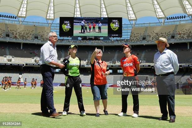 Alex Blackwell of the Thunder and Elyse Villani of the Scorchers look on during the coin toss during the Women's Big Bash League match between the...
