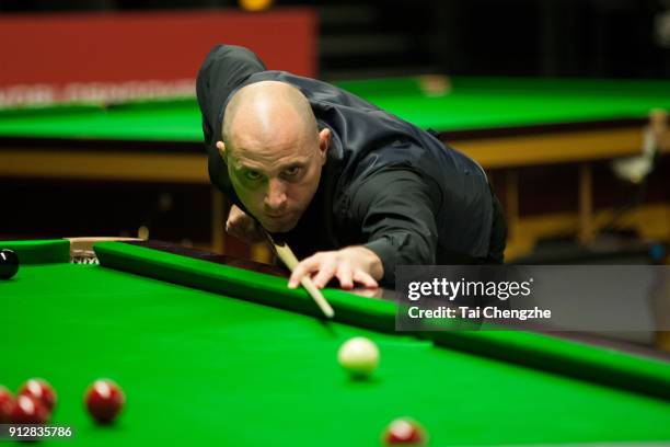 Joe Perry of England plays a shot in his first round match against Yu Delu of China on day one of 2018 D88 German Masters at Tempodrom on January 31,...