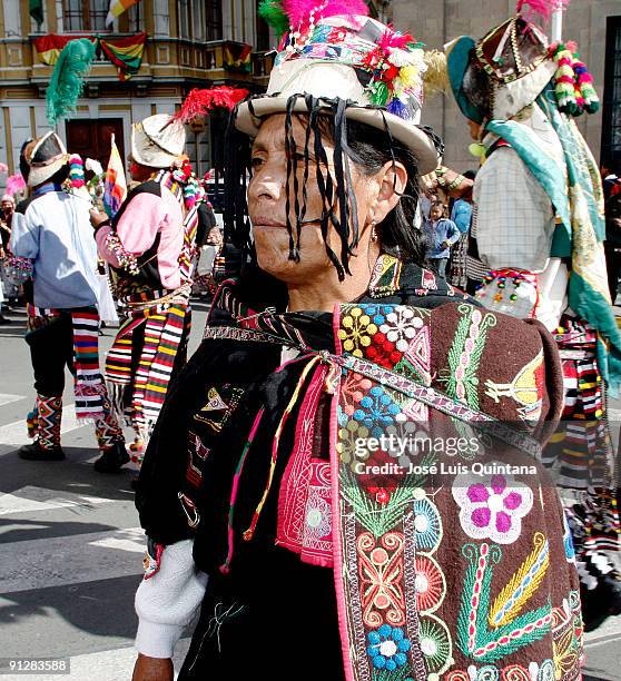 An indian from San Pedro de Macha, Bolivia, watches his countrymen dance the Tinku in front of the National Parliament at Murillo Square during a...