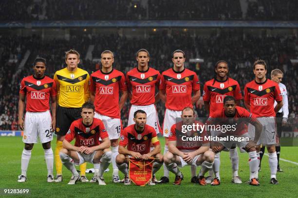 The Manchester United players pose for a team photo prior to the UEFA Champions League Group B match between Manchester United and VfL Wolfsburg at...