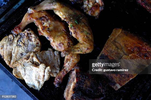 roast pork and chicken on charcoal grill - crackling stock pictures, royalty-free photos & images