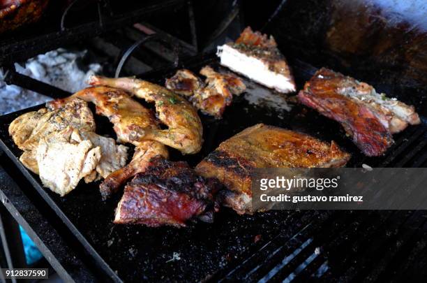 roast pork and chicken on charcoal grill - pork shoulder stock pictures, royalty-free photos & images