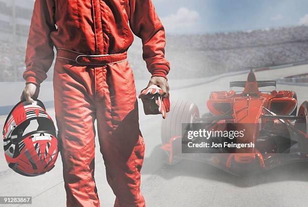 driver walking away from open-wheel single-seater racing car race car. - pilota di auto da corsa foto e immagini stock
