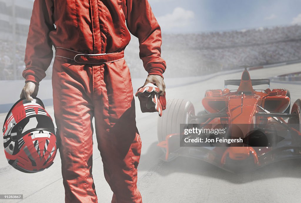 Driver walking away from open-wheel single-seater racing car race car.