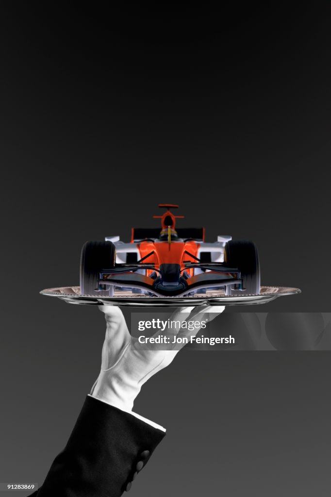 Open-wheel single-seater racing car race car on silver platter.