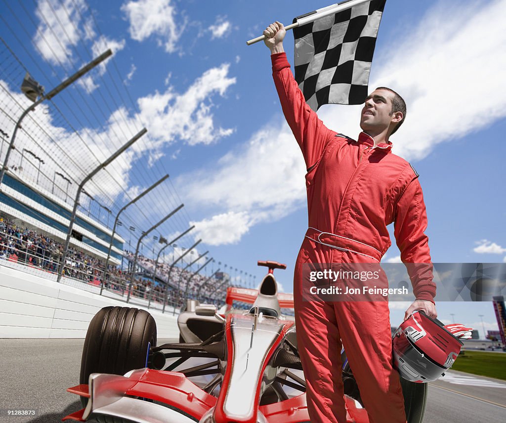 Winning Race Car Driver Standing In Front Of Car Stock-Foto - Getty Images