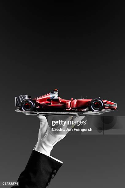 open-wheel single-seater racing car race car on silver platter. - white glove stock pictures, royalty-free photos & images