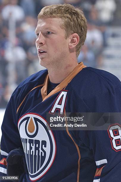 Ales Hemsky of the Edmonton Oilers stands for the National Anthems before a pre-season game against the New York Islanders on September 15, 2009 at...