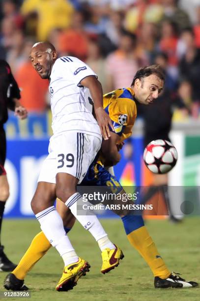 Chelsea's Nicolas Anelka fights for the ball with Christos Contis of APOEL during their Champions League football match at the GSP stadium in the...