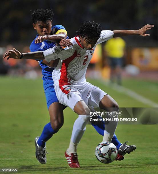Honduras player Mario Martinez vies for the ball with Emirates player' Saad Surour during their Group F FIFA U-20 World Cup football match in the...