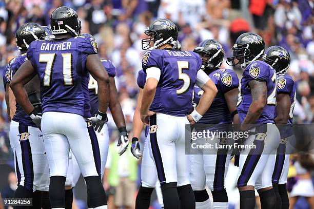 Joe Flacco of the Baltimore Ravens huddles with the offense during the game against the Cleveland Browns at M&T Bank Stadium on September 27, 2009 in...