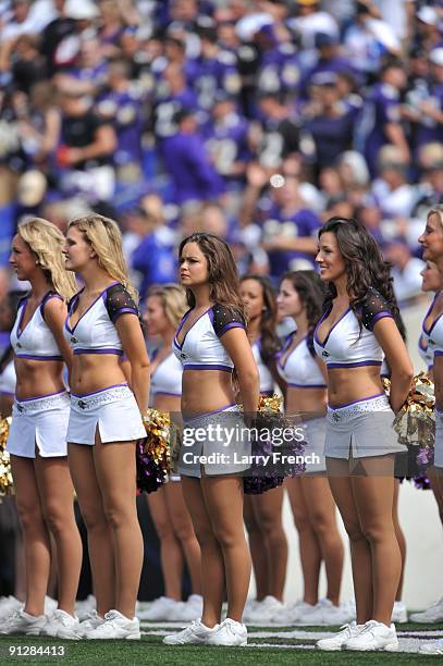 Cheerleaders for the Baltimore Ravens stand during the national anthem before the game against the Cleveland Browns at M&T Bank Stadium on September...