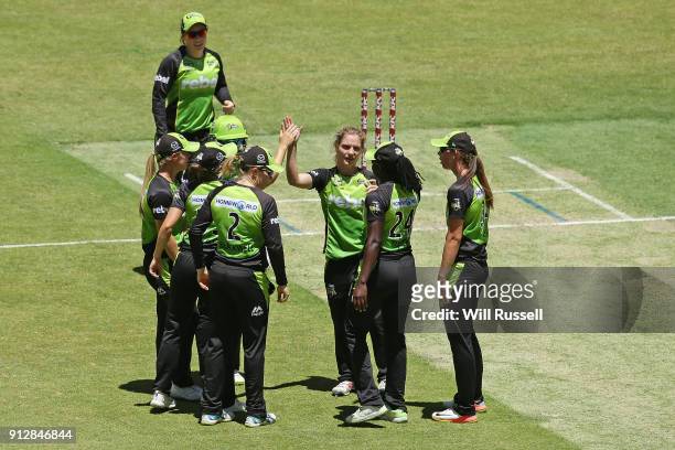 Nicola Carey of the Thunder celebrates the wicket of Elyse Villani of the Scorchers during the Women's Big Bash League match between the Sydney...