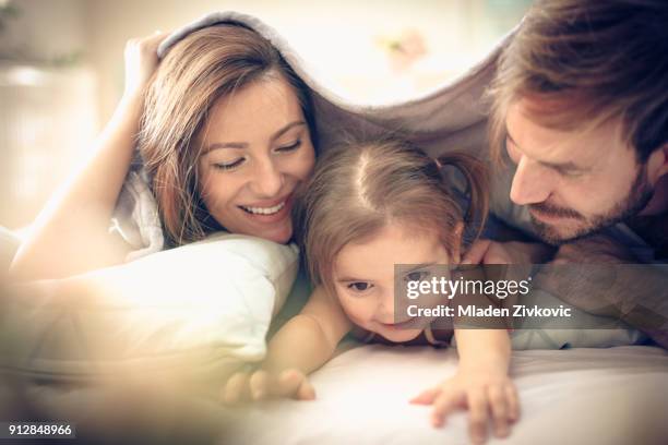 playing under blanket. - duvet inners stock pictures, royalty-free photos & images