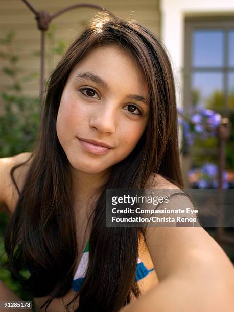 portrait of brown-eyed girl with long dark hair - brown eyed girls stock pictures, royalty-free photos & images