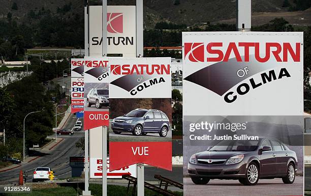 Signage remains on the sales lot of the closed Saturn of Colma dealership September 30, 2009 in Colma, California. General Motors announced today...