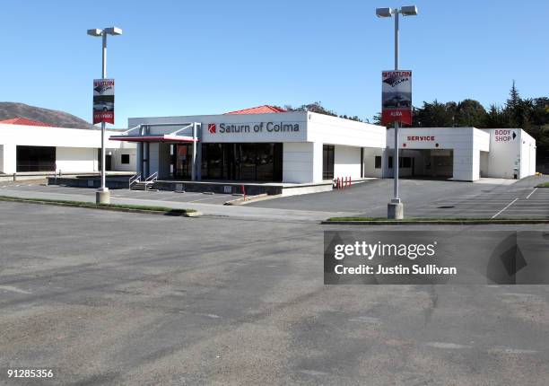 The closed Saturn of Colma dealership sales lot sits empty September 30, 2009 in Colma, California. General Motors announced today that they will...