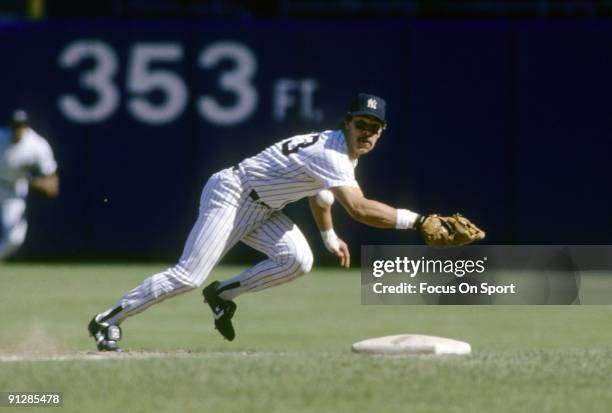 S: First baseman Don Mattingly of the New York Yankees ready for action dives for a ball hit down the firstbase line during a mid circa 1980's Major...