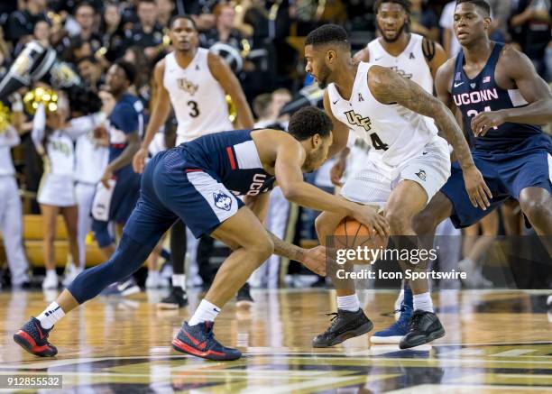Connecticut Huskies guard Jalen Adams looks to pass during the UCF Knights and the Connecticut Huskies on January 31st 2018 at CFE Arena in Orlando,...