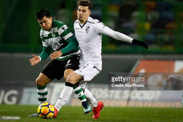 Guimaraes's midfielder Fabio Sturgeon vies withb Sporting's midfielder Marcos Acuna during the Portuguese League football match between Sporting CP...
