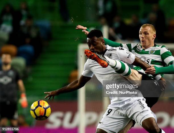 Sporting's defender Jeremy Mathieu vies with Guimaraes's forward Junior Tallo during the Portuguese League football match between Sporting CP and...