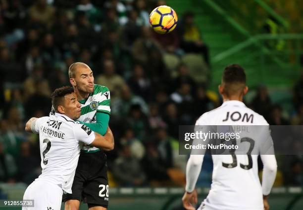 Sporting's forward Bas Dost vies with Guimaraes's defender Pedro Henrique during the Portuguese League football match between Sporting CP and Vitoria...