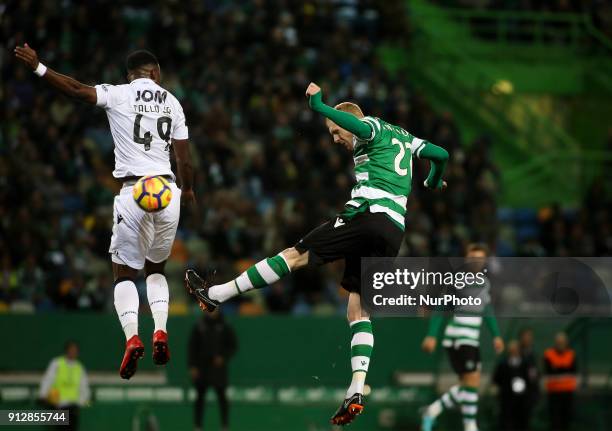 Sporting's defender Jeremy Mathieu vies with Guimaraes's forward Junior Tallo during the Portuguese League football match between Sporting CP and...