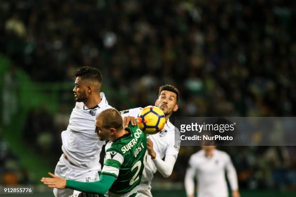 Sporting's forward Bas Dost vies with Guimaraes's defender Jubal and Guimaraes's midfielder Joao Aurelio during the Portuguese League football match...