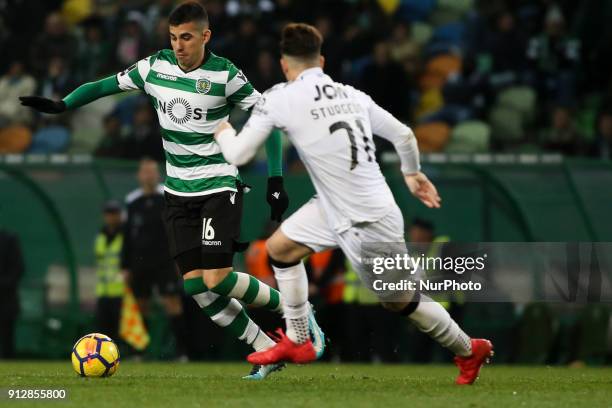 Sporting's midfielder Rodrigo Battaglia vies with Guimaraes's midfielder Fabio Sturgeon during the Portuguese League football match between Sporting...