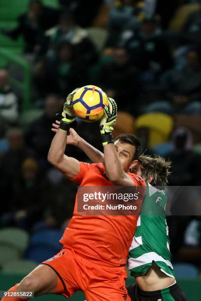 Guimaraes's goalkeeper Douglas Jesus vies with Sporting's defender Fabio Coentrao during the Portuguese League football match between Sporting CP and...