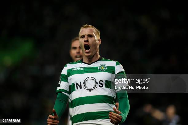 Sporting's defender Jeremy Mathieu celebrates after scoring during the Portuguese League football match between Sporting CP and Vitoria SC at Jose...