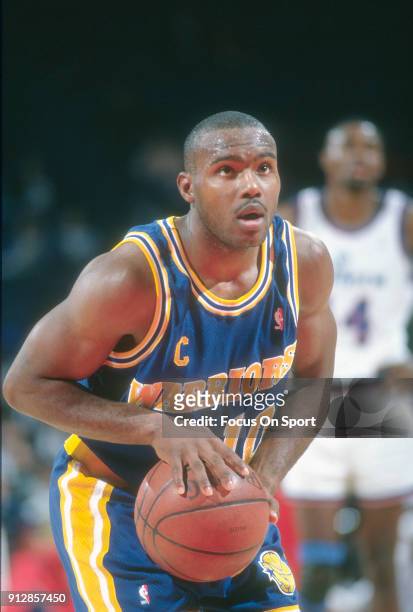 Tim Hardaway of the Golden State Warriors shoots a free throw against the Washington Bullets during an NBA basketball game circa 1992 at the Capital...