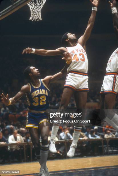 Toby Knight of the New York Knicks leaps for a rebound against the Indiana Pacers during an NBA basketball game circa 1978 at Madison Square Garden...