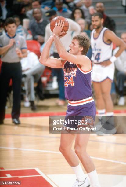 Tom Chambers of the Phoenix Suns shoots a free throw against the Washington Bullets during an NBA basketball game circa 1990 at the Capital Centre in...