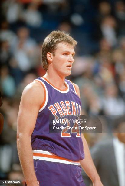 Tom Chambers of the Phoenix Suns looks on against the Washington Bullets during an NBA basketball game circa 1990 at the Capital Centre in Landover,...