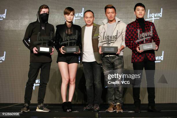 Alan Walker , singers Chris Lee , Nicholas Tse and Seung-Ri attend a news conference after Chinese internet giant Tencent and Sony Music...